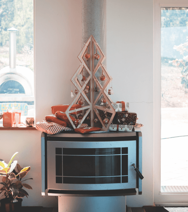 A DIY mini Christmas Tree made of wood with Christmas balls