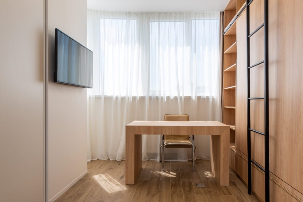 Make the most of vertical space by installing tall shelves and cabinets. Floor-to-ceiling units not only maximise storage capacity but also draw the eye upwards, creating the illusion of a larger space. Use wall-mounted shelves and hooks for extra storage without taking up valuable floor space.