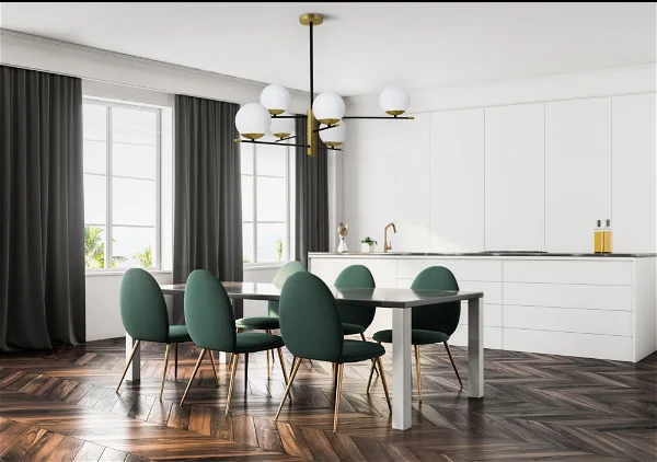 a spacious dining room with green chairs and a pendant light