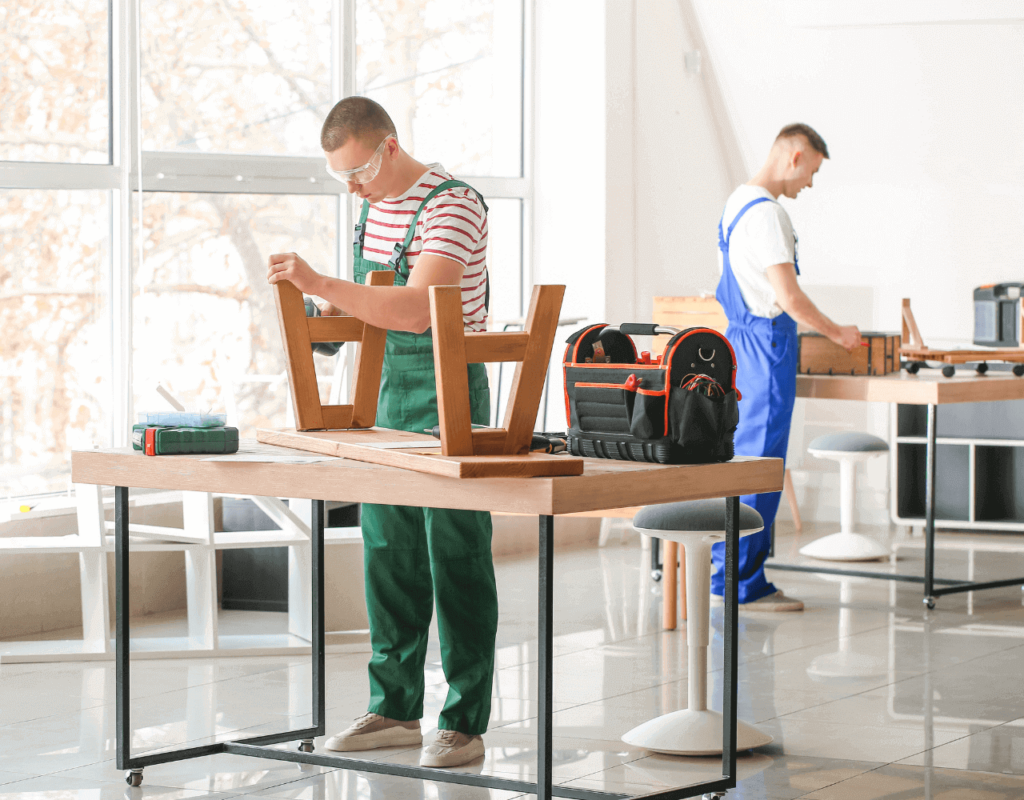 A two man doing some carpentry in a well lit space