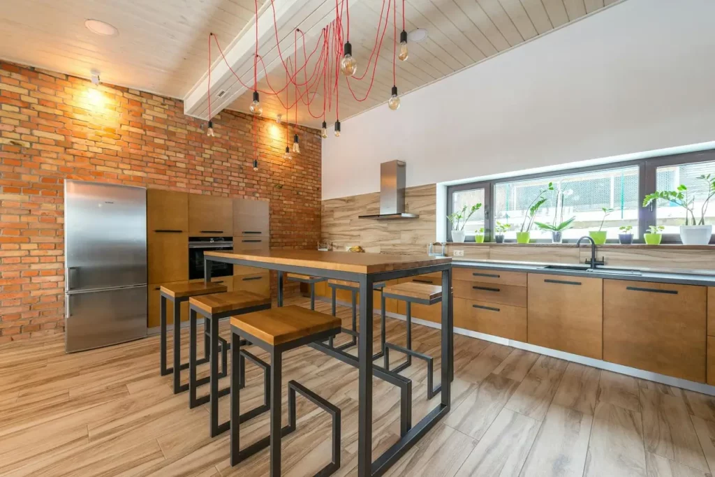 Industrial style kitchen with metal bar chairs