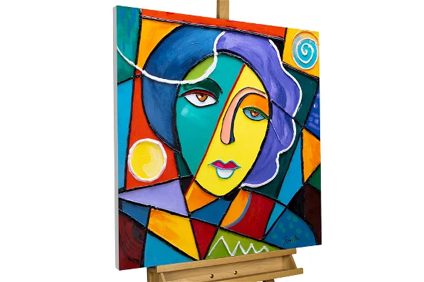 Vivid Picasso-style portrait with geometric and colorful sections on a wooden easel, ideal for contemporary art lovers.