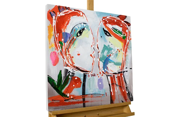 Abstract expressionist painting featuring bold, splashy faces on a white canvas, displayed on an easel, perfect for modern art collections.