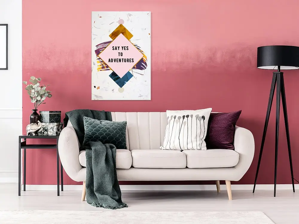 Living room painting with soft sofa and floor lamp with a motivational quote art print ‘Say Yes to Adventures’