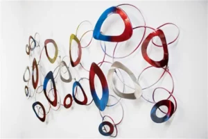Close-up of interconnected abstract metal loops in vibrant colors.