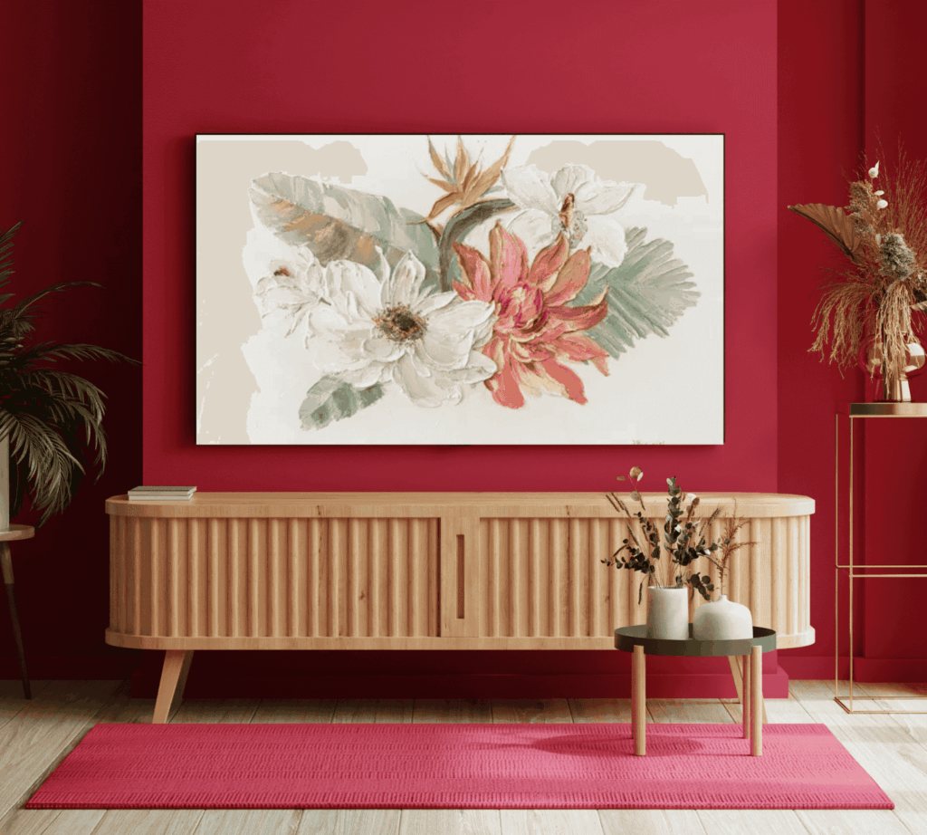 Floral wall art in a red-themed living room with wooden furniture
