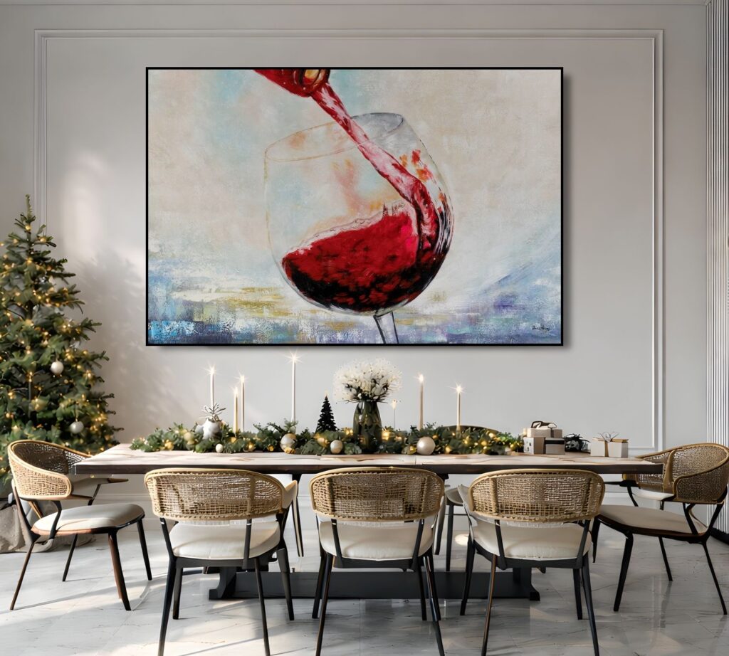 A wide painting of a red wine glass splashing liquid, hung over a long dining table set for a holiday meal.