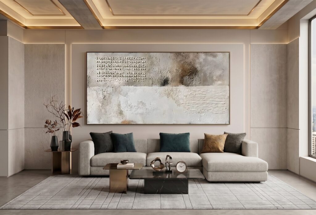Modern living room with large textured abstract artwork above a cream sofa.