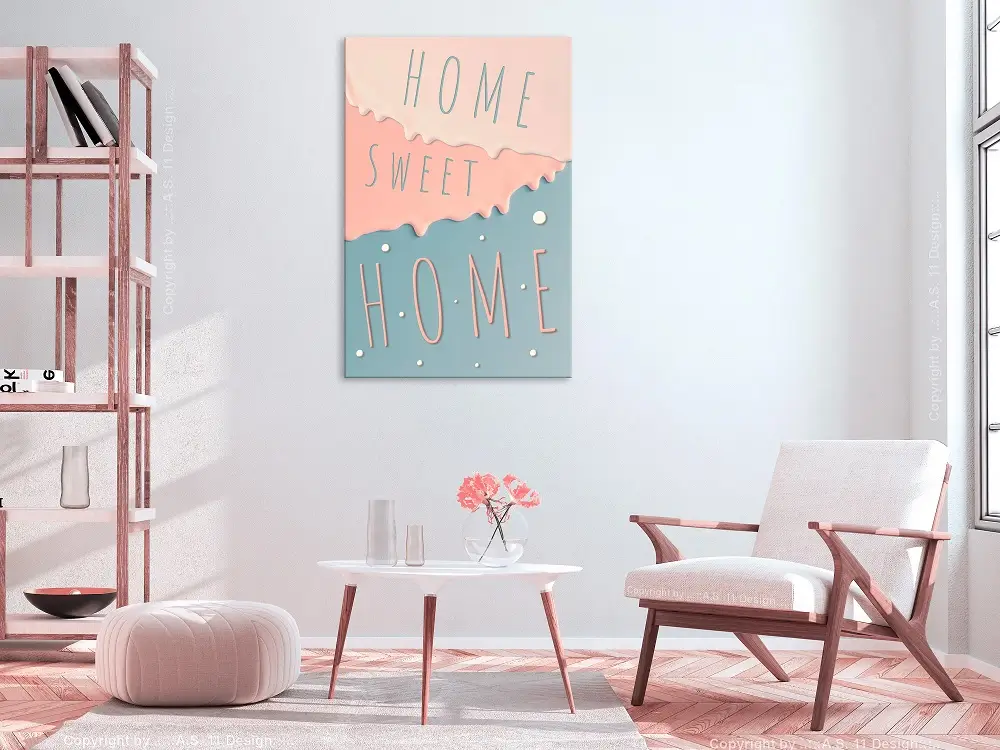 Living room picture with an armchair, a coffee table and a motivational quote from ‘home sweet home’ as an art print